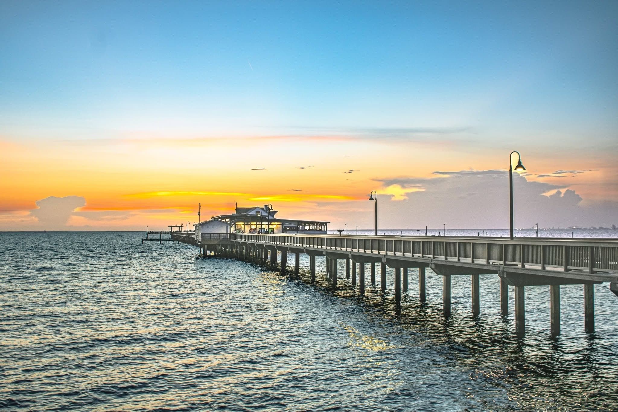 The pier at sunset over Mobile Bay